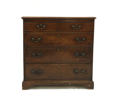 Lot 306 - An oak chest of two short over three long drawers