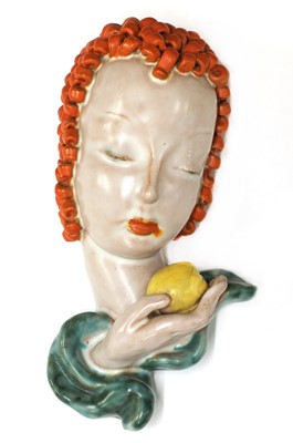 Lot 215 - A small Goldscheider pottery wall mask