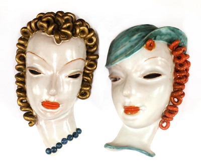 Lot 129 - Two Goldscheider pottery wall masks
