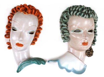 Lot 126 - Two Goldscheider pierced eye pottery wall masks