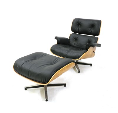 Lot 311 - A modern walnut lounger and ottoman