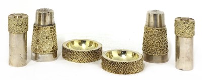Lot 328 - A matched silver-gilt condiment set