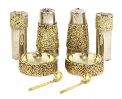 Lot 328 - A matched silver-gilt condiment set