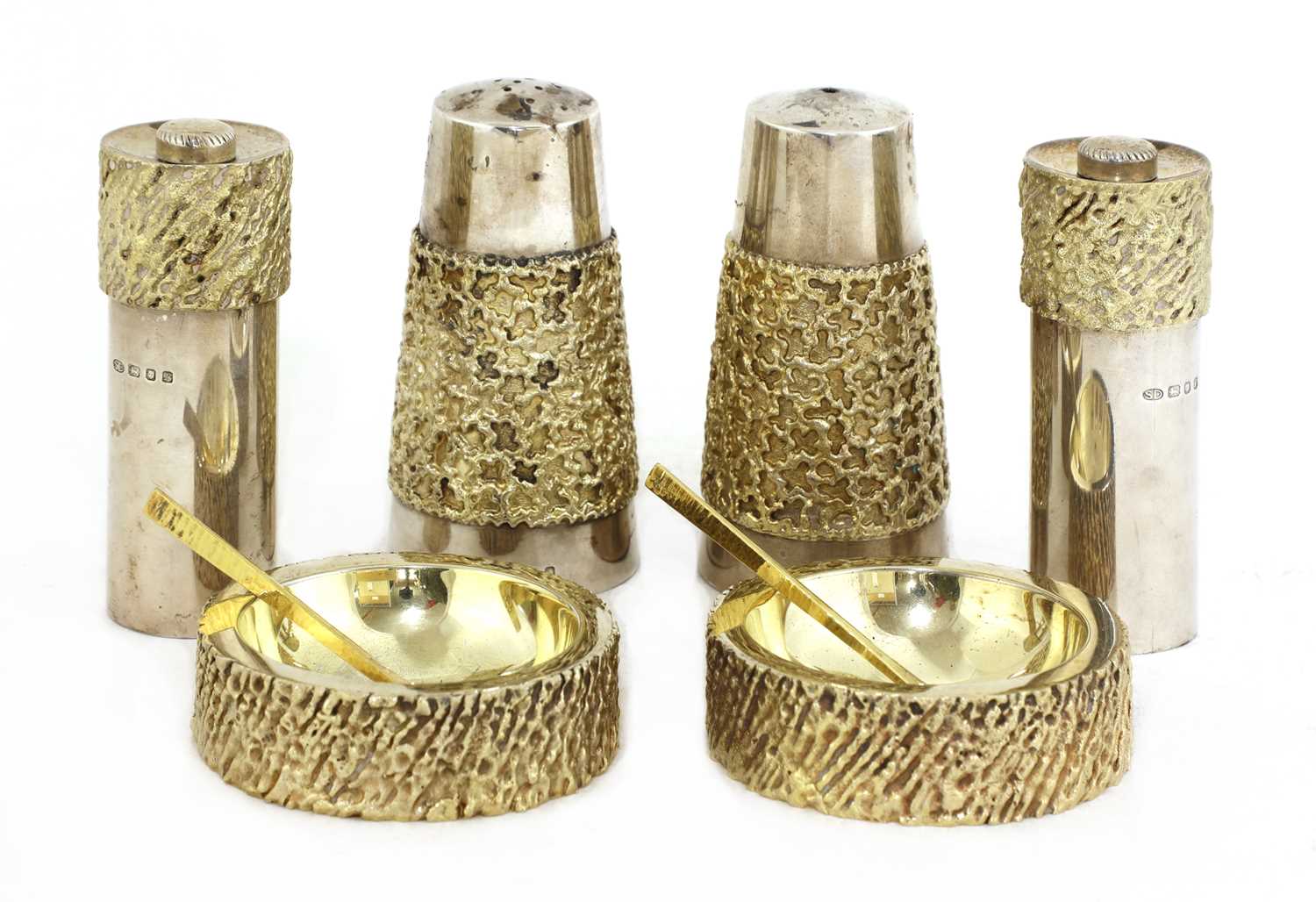Lot 328 - A matched silver-gilt condiment set