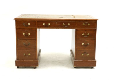 Lot 552 - A mahogany nine drawer kneehole desk