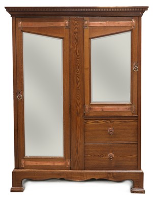 Lot 59 - An Arts and Crafts oak mirrored wardrobe