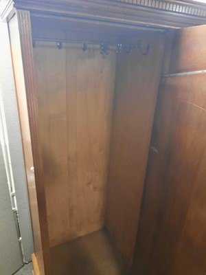 Lot 59 - An Arts and Crafts oak mirrored wardrobe