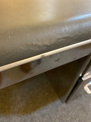 Lot 153 - A polished steel desk