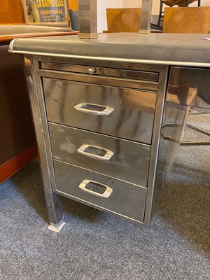 Lot 153 - A polished steel desk