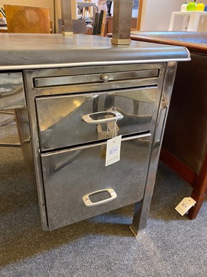 Lot 153 - A polished steel desk