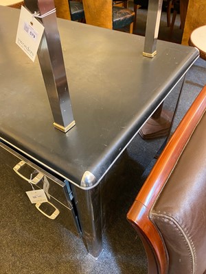 Lot 153 - A polished steel desk