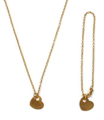 Lot 70 - A 9ct gold heart shaped disc pendant