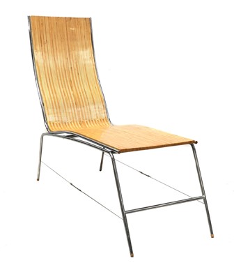 Lot 381 - A laminated wood chaise lounge