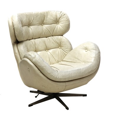 Lot 380 - A white leather armchair