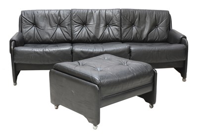 Lot 531 - A black three-seater leather sofa