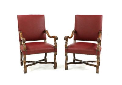 Lot 396 - A pair of carved walnut elbow chairs