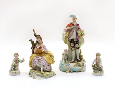 Lot 97 - A Capo di Monti porcelain figure of a seated female reading
