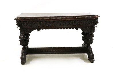 Lot 569 - A Victorian carved oak centre table