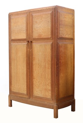 Lot 64 - An Arts and Crafts oak wardrobe