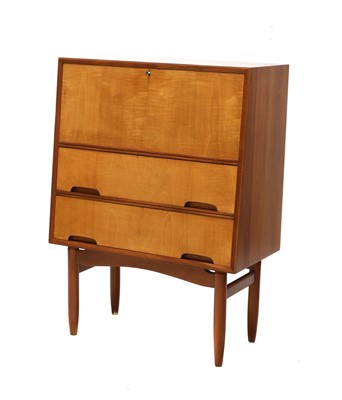 Lot 411 - A teak and maple bureau