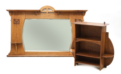 Lot 70 - An Arts and Craft oak wall mirror