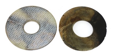 Lot 275 - A Chinese jade bi disc