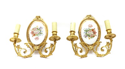 Lot 193 - A pair of cast bronze two branch wall lights