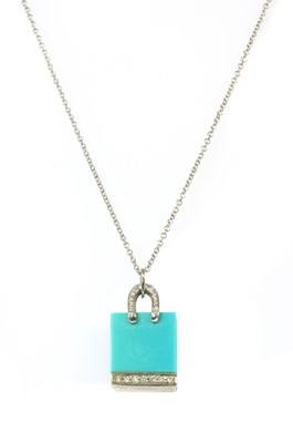 Lot 202 - A platinum turquoise and diamond shopping bag pendant/charm by Tiffany & Co.
