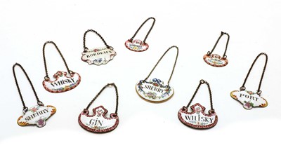 Lot 220A - Fourteen enamel wine labels and a ceramic example, comprising