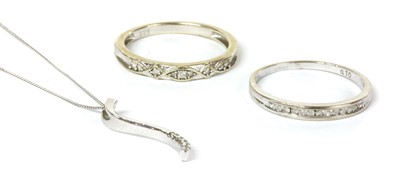 Lot 237 - A white gold diamond half eternity ring