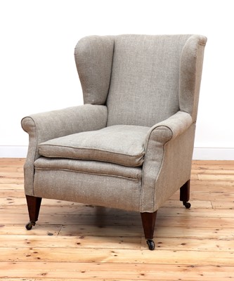 Lot 144 - A wingback armchair