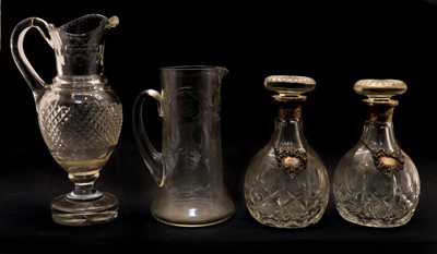 Lot 243 - A pair of cut crystal glass decanters