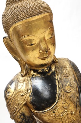 Lot 70 - A large South-East Asian wooden and lacquered Shakyamuni buddha