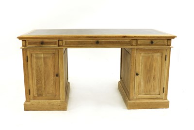 Lot 415 - A modern oak twin pedestal desk