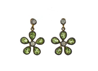 Lot 195 - A pair of silver and gold, peridot and diamond floral cluster earrings