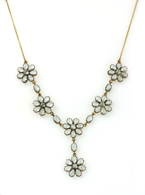 Lot 185 - A silver and gold, blue topaz necklace