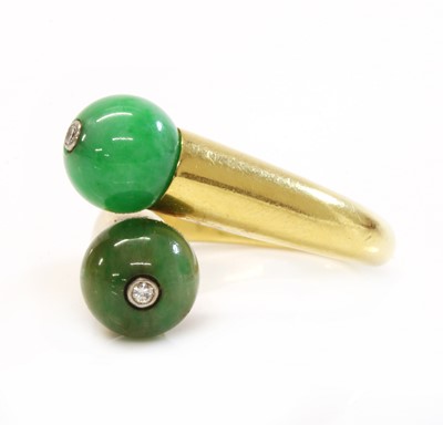 Lot 186 - A two stone jade bead and diamond crossover ring, by Cartier
