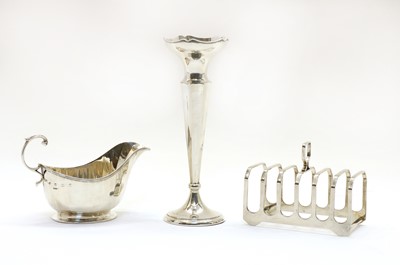 Lot 30 - A modern silver six division toast rack by Elkington & Co