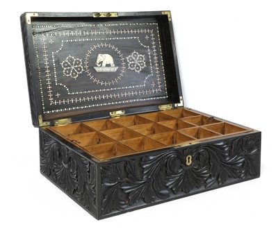 Lot 97 - A Ceylonese carved ebony workbox