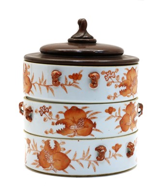 Lot 109 - A Chinese iron-red stacking box
