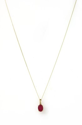 Lot 143 - A gold single stone fracture filled ruby pendant