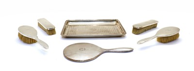Lot 81 - A five piece silver backed dressing table set
