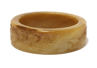 Lot 100 - A Chinese jade bangle