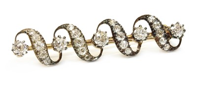 Lot 47 - A late Victorian diamond set ribbon bar brooch, c.1880