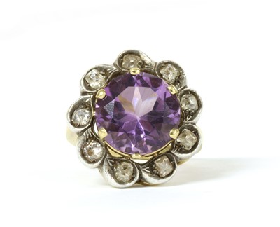 Lot 156 - A silver and gold, amethyst and diamond cluster ring