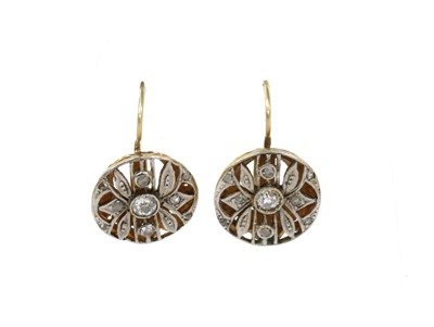 Lot 100 - A pair of gold diamond set clusters