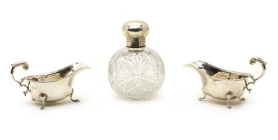 Lot 102 - A pair of silver sauceboats