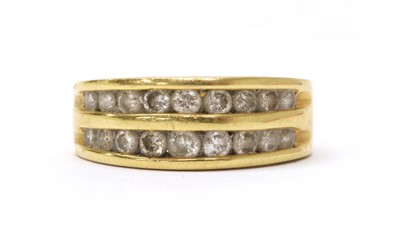 Lot 49 - A gold two row diamond set half eternity ring