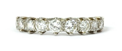 Lot 1203 - A platinum diamond half eternity ring, c.1950