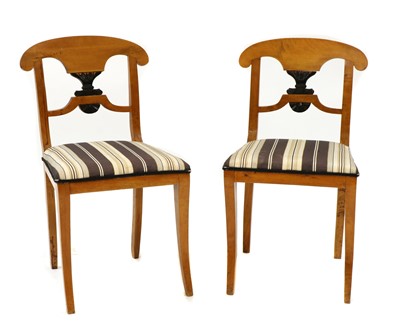 Lot 388 - A pair of Biedermeier maple side chairs
